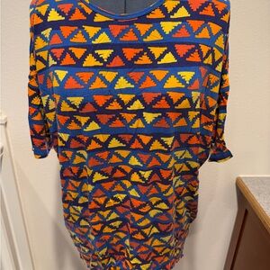 LuLaRoe Irma Tunic Short Sleeve Top in Blue, Orange & Yellow Geometric Print